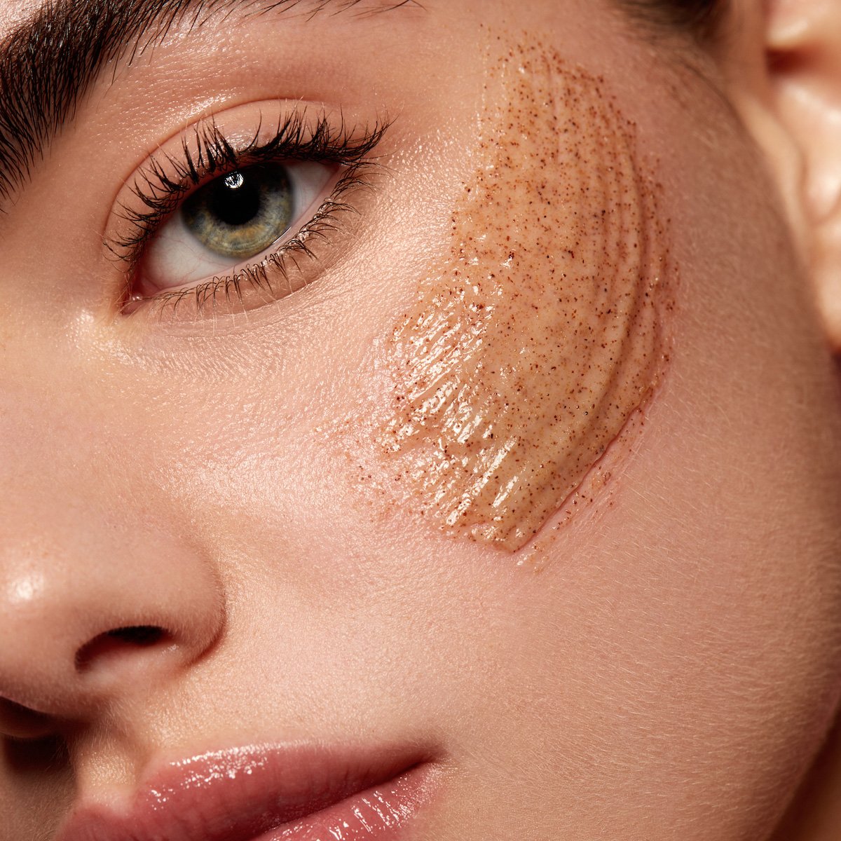 Model using Kylie Skin Walnut Face Scrub by Kylie Jenner